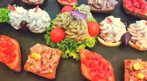 High angle view of assorted appetizers on table