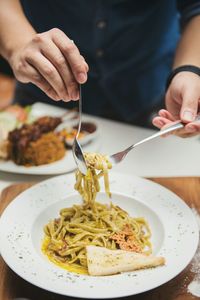 Close-up of man preparing food