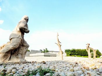 View of statue against rock