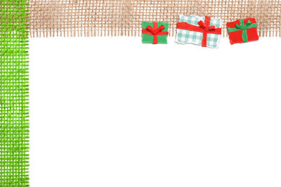 Low angle view of paper flags against white wall