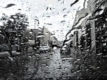 Full frame shot of wet glass window in rainy season