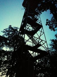 Low angle view of silhouette built structure against sky