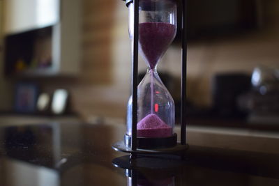 Close-up of hourglass on table