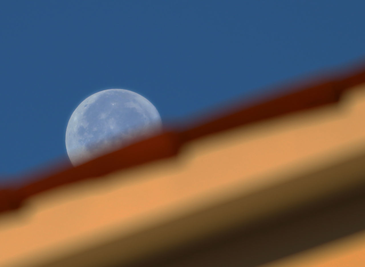 LOW ANGLE VIEW OF BLUE SKY AND MOON