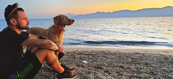 Man with dog on beach