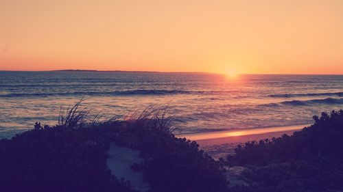 Scenic view of sea against sky during sunset