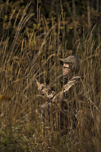 Teenage boy with rifle at hunting