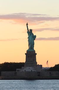 Statue of liberty against sky during sunset