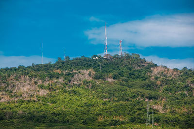 Low angle view of communications tower against sky