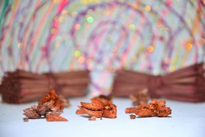 Close-up of autumn leaves on table
