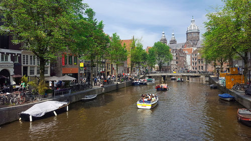 Group of people in boats at canal