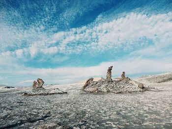 Scenic view of landscape against cloudy sky