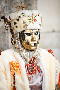 Close-up of mask against white wall