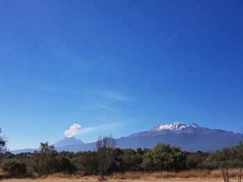 Scenic view of popocatepetl vulcano against clear blue sky