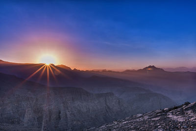Scenic view of mountains during sunset