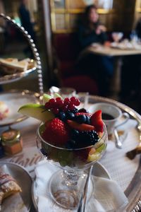 Close-up of strawberries on glass table
