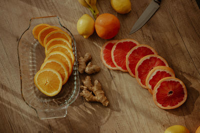 High angle view of oranges on cutting board