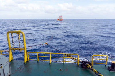 A tow tug towing a construction work barge at offshore terengganu oil field