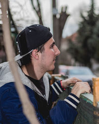 Portrait of young man holding ice cream cone