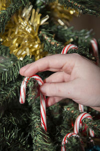 Close-up of hand holding christmas decoration