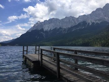 Scenic view of lake and mountains against sky