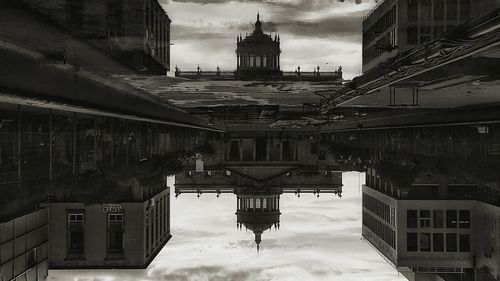 Buildings against cloudy sky