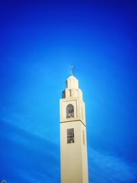 Low angle view of building against blue sky
