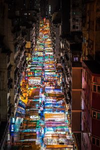 Low angle view of illuminated market at night