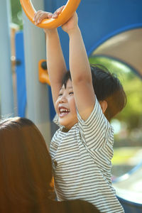 Mother and son playing at playground