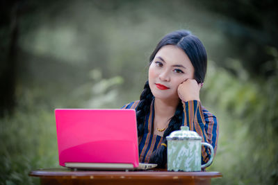 Young woman using phone