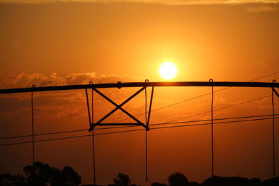 Silhouette bridge against sky during sunset