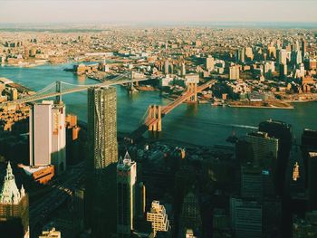 Aerial view of manhattan bridge and brooklyn bridge over east river in city