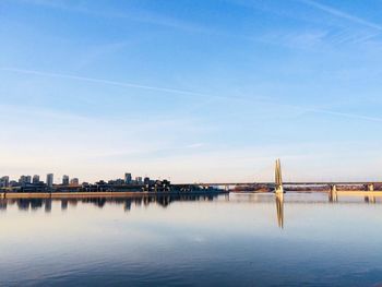 Bridge over river with buildings in background