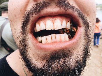 Close-up of man chewing betel leaf