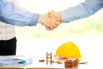 Low angle view of man working on table