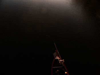 High angle view of illuminated ship in sea against sky