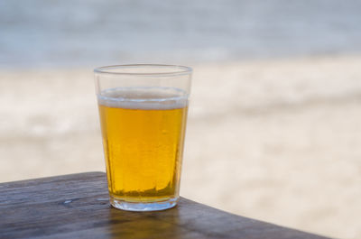 Close-up of beer in glass on table