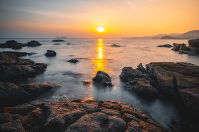 Scenic view of sea against sky during sunset