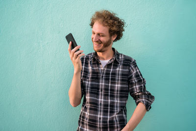 Mid adult man looking at camera