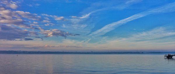 Scenic view of sea against blue sky