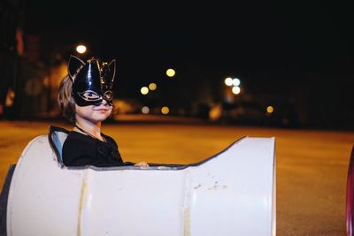 Man wearing mask at night