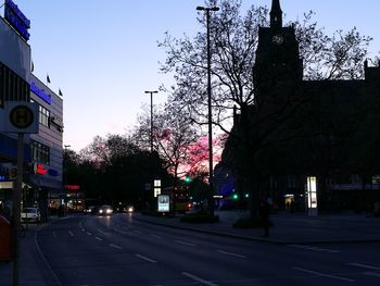 Road in city against clear sky