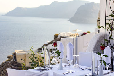 Scenic view of sea and mountains seen through glass