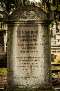 Close-up of cross in cemetery