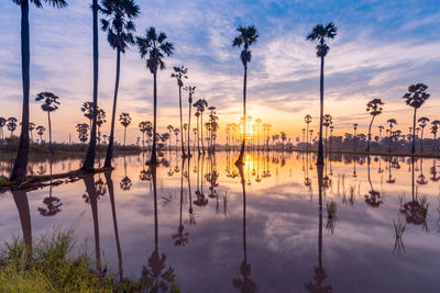 Scenic view of lake against sky during sunset