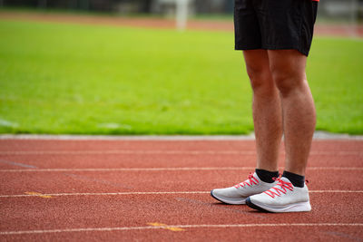 Low section of person running on floor