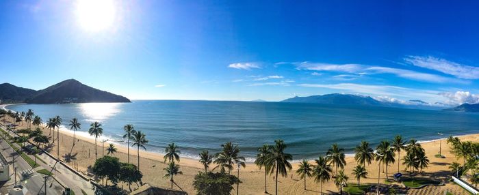 Panoramic view of sea against blue sky