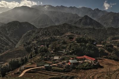 High angle view of buildings and mountains against sky