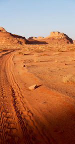 Scenic view of desert against clear sky