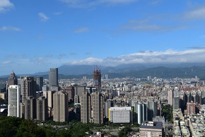 Modern buildings in city against sky